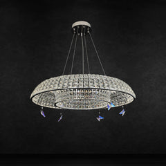 Qulik Allure circle crystal chandelier with layered crystal rings, silver finish and decorative butterfly accents.