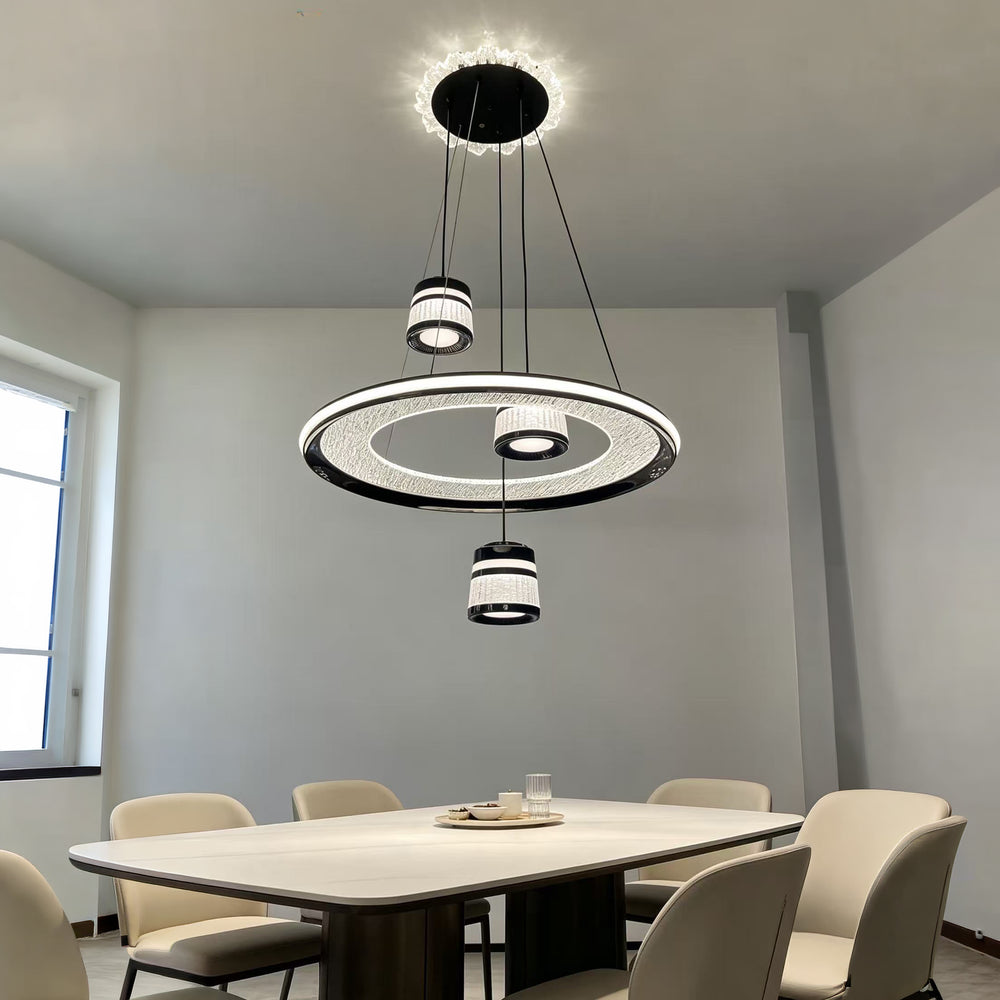 Qulik black crystal LED hanging light with an illuminated circular crystal ring, three cascading cylindrical pendants and black accents, model QL-2267HL.