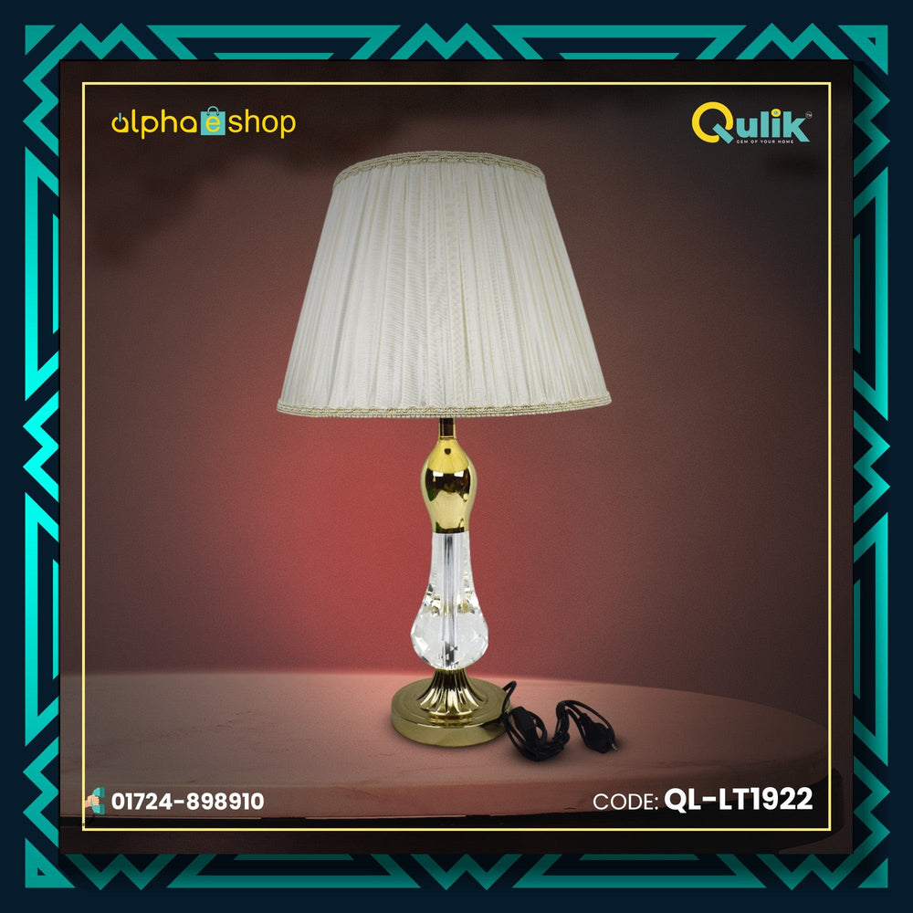 Qulik traditional table lamp with clear crystal body, polished gold accents and pleated white fabric shade, model QL-LT1922.