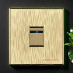 Belamy Gold 1 gang 2 way switch with brushed gold finish, slim rocker design and blue power indicator, model BE-138-SW.