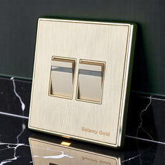 Belamy Gold 2 gang 1 way switch with dual rocker controls, power indicator strips and brushed gold finish, model BE-134-SW.