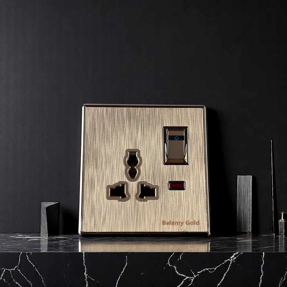 Belamy Gold 3-pin socket with separate rocker switch, LED indicator and brushed gold finish, model BE-142-SW.
