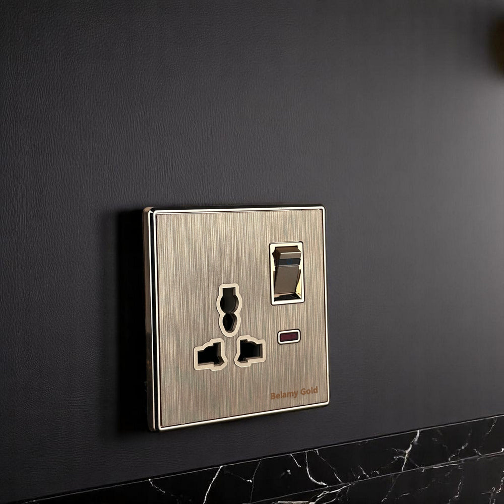 Belamy Gold 3-pin socket with separate rocker switch, LED indicator and brushed gold finish, model BE-142-SW.