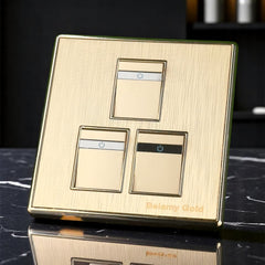 Belamy Gold 3 gang 1 way switch with three rocker controls, power indicator strips and brushed gold finish, model BE-135-SW.