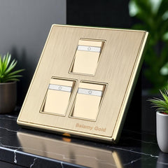 Belamy Gold 3 gang 1 way switch with three rocker controls, power indicator strips and brushed gold finish, model BE-135-SW.