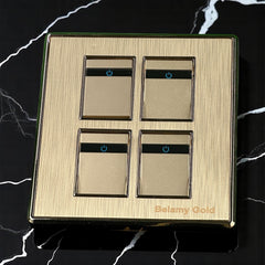 Belamy Gold 4 gang 1 way switch with four rocker controls, blue power indicators and brushed gold finish, model BE-136-SW.