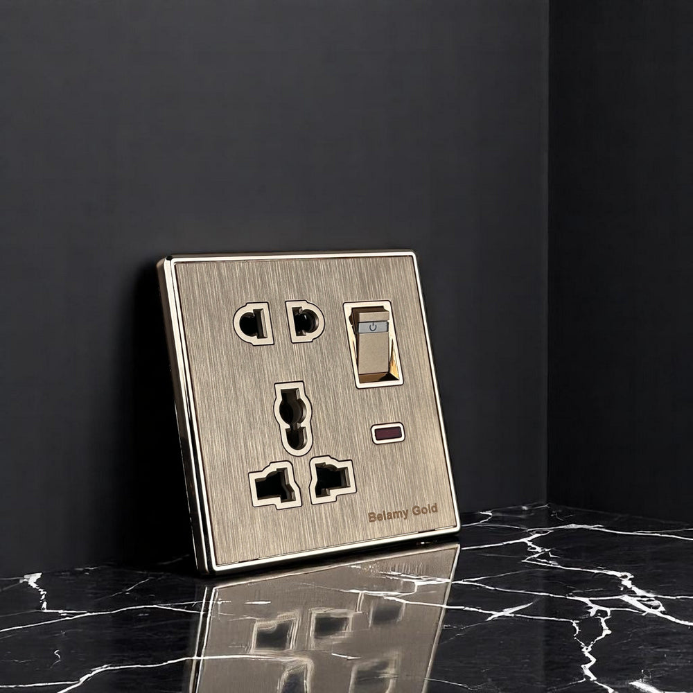 Belamy Gold multi 5-pin socket with rocker switch, LED indicator and brushed gold finish, model BE-141-SW.