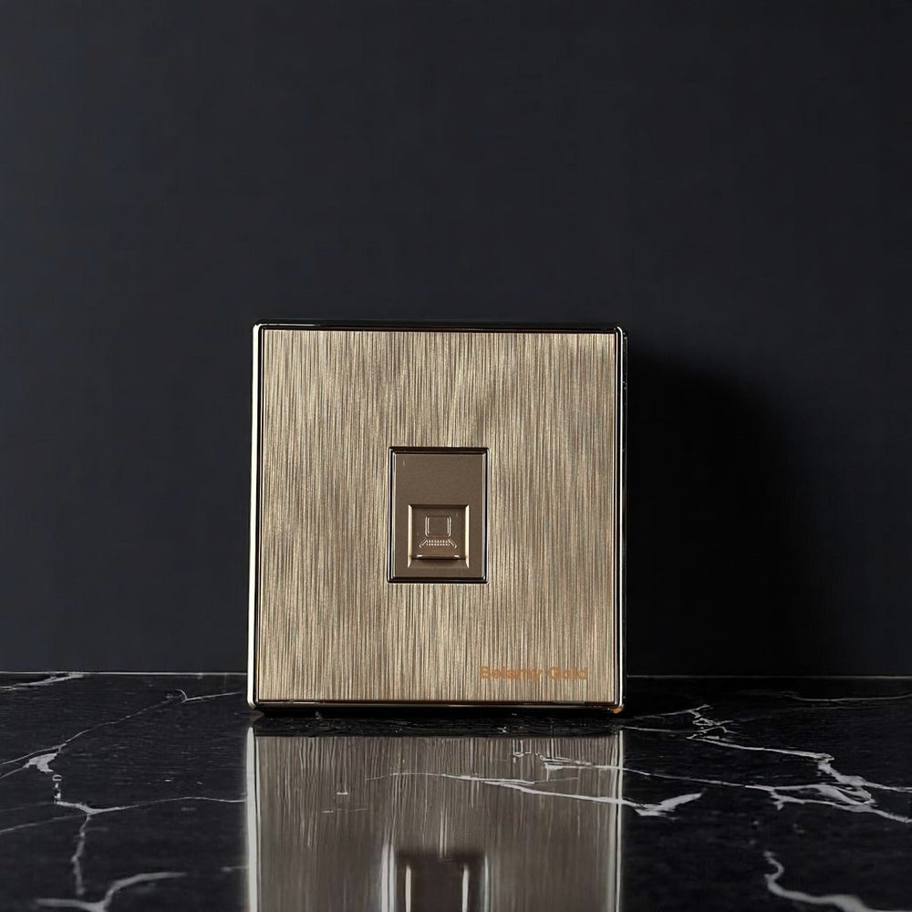 Belamy Gold telephone socket with brushed gold finish and single modular telephone port, model BE-146-SW.
