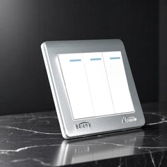 Belamy white-grey 3 gang 1 way wall switch with three rocker switches, blue indicators and silver-grey frame, model BE-118-SW.