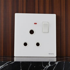 Belamy white 1 gang 3-pin round socket with rocker switch and red indicator light, model BE-151-SW.