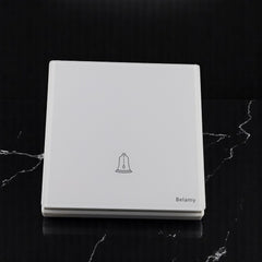 Belamy white push bell switch with bell icon and minimalist white wall plate design, model BE-155-SW.