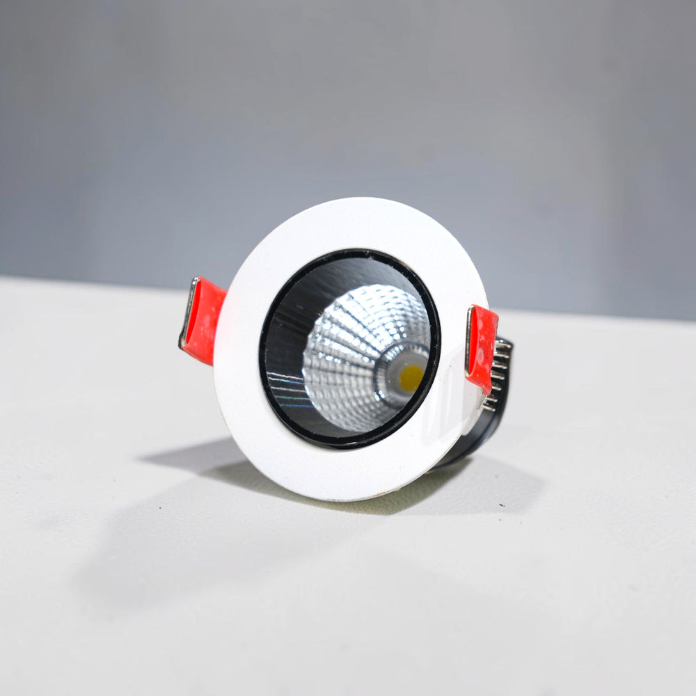 Energy Plus 1285 5W round LED concealed spot light with white trim, black inner ring, textured silver reflector and red mounting clips.