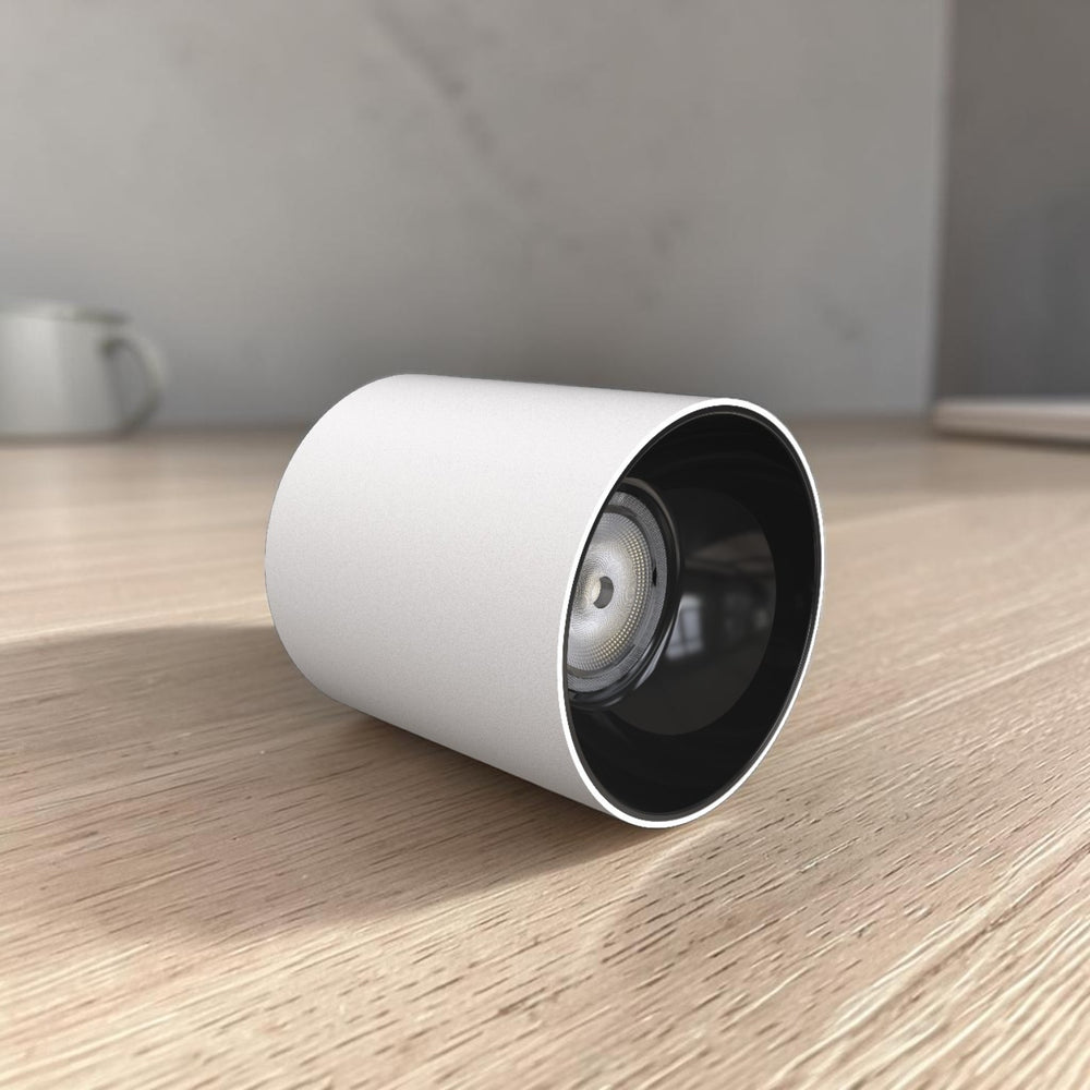 Energy Plus 41028 10W LED surface spot light in white with cylindrical housing, black recessed interior and LED lens, model SS41028.