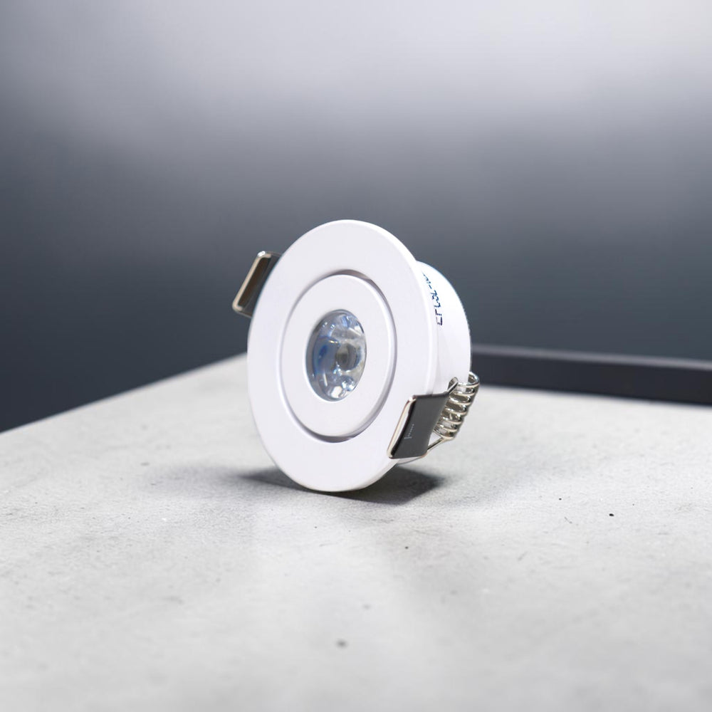 Energy Plus 6137 1W LED concealed spot light with a white circular frame, clear central lens and metal spring mounting clips.