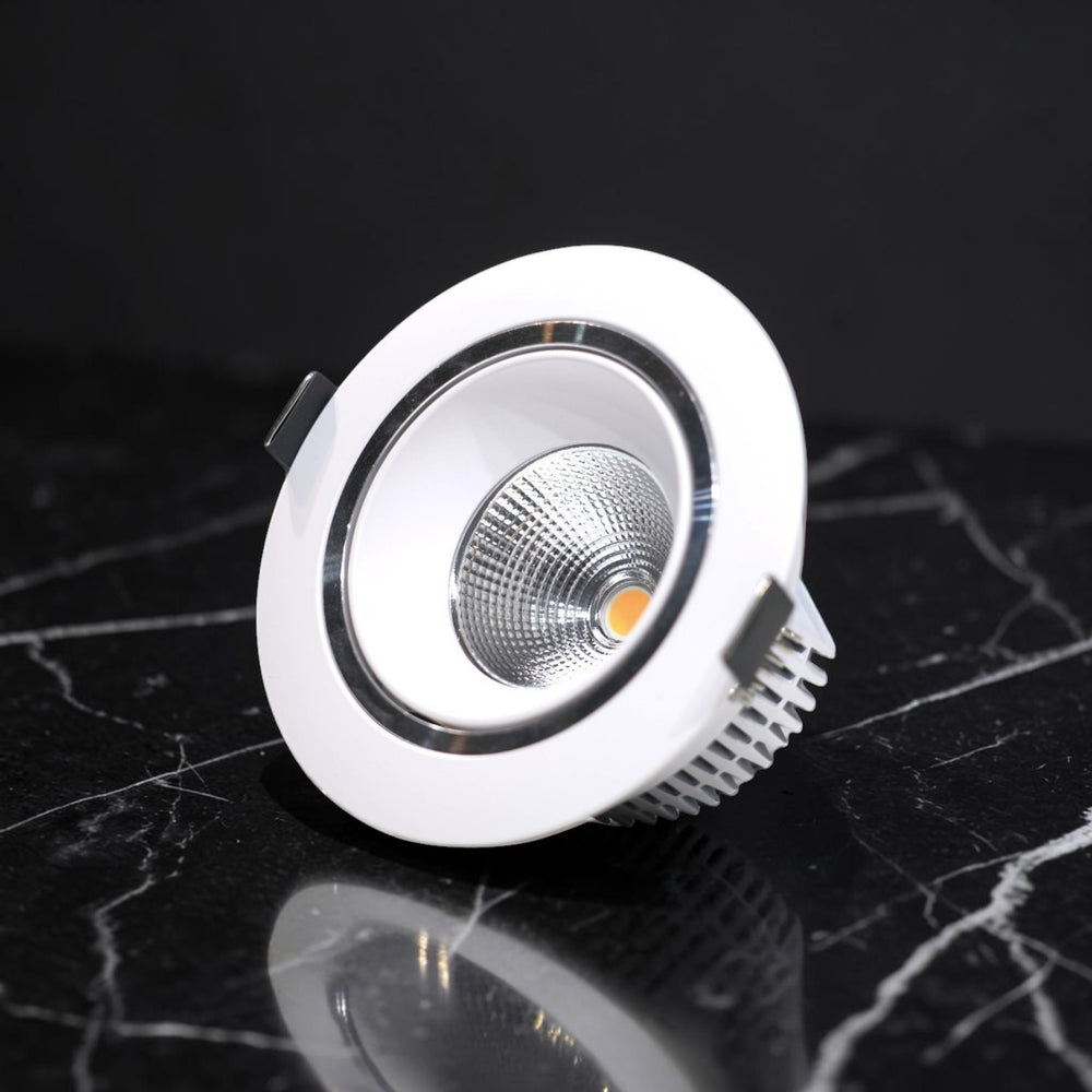 Energy Plus 664 12W round LED concealed spot light with a white frame, silver reflector and finned heat sink.