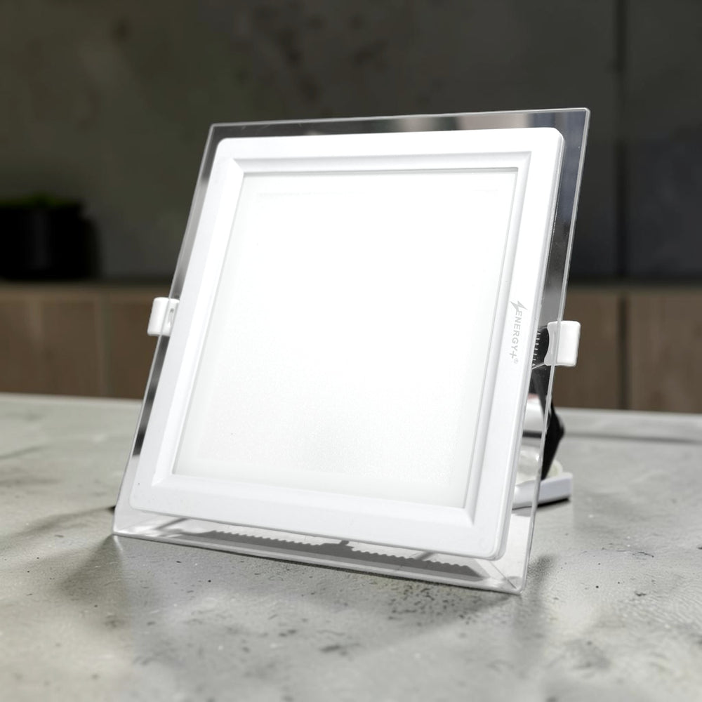 Energy Plus Cozy Panel 2015 (700) 18W square recessed panel light with a white diffuser, clear outer frame and side mounting clips.