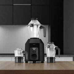 Havells Hexo Plus 1100W Mixer Grinder (H-1088-MG) in black, featuring three stainless steel jars. Available at Alphaeshop.