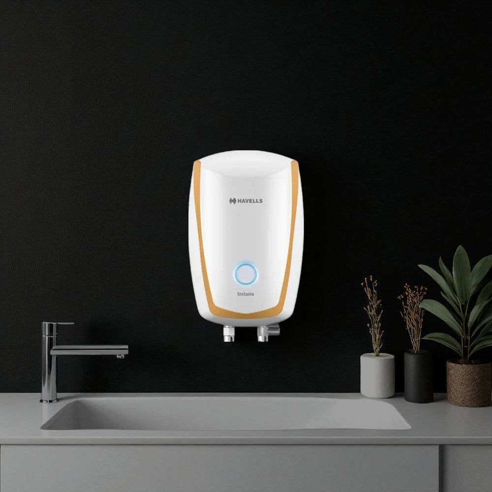 Havells Instanio 3L instant water geyser in white and gold with compact wall-mounted design and front status indicator.