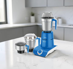 Havells Maxx Grind Plus 750W mixer grinder in blue and white with three stainless steel jars, model H-1085-MG.