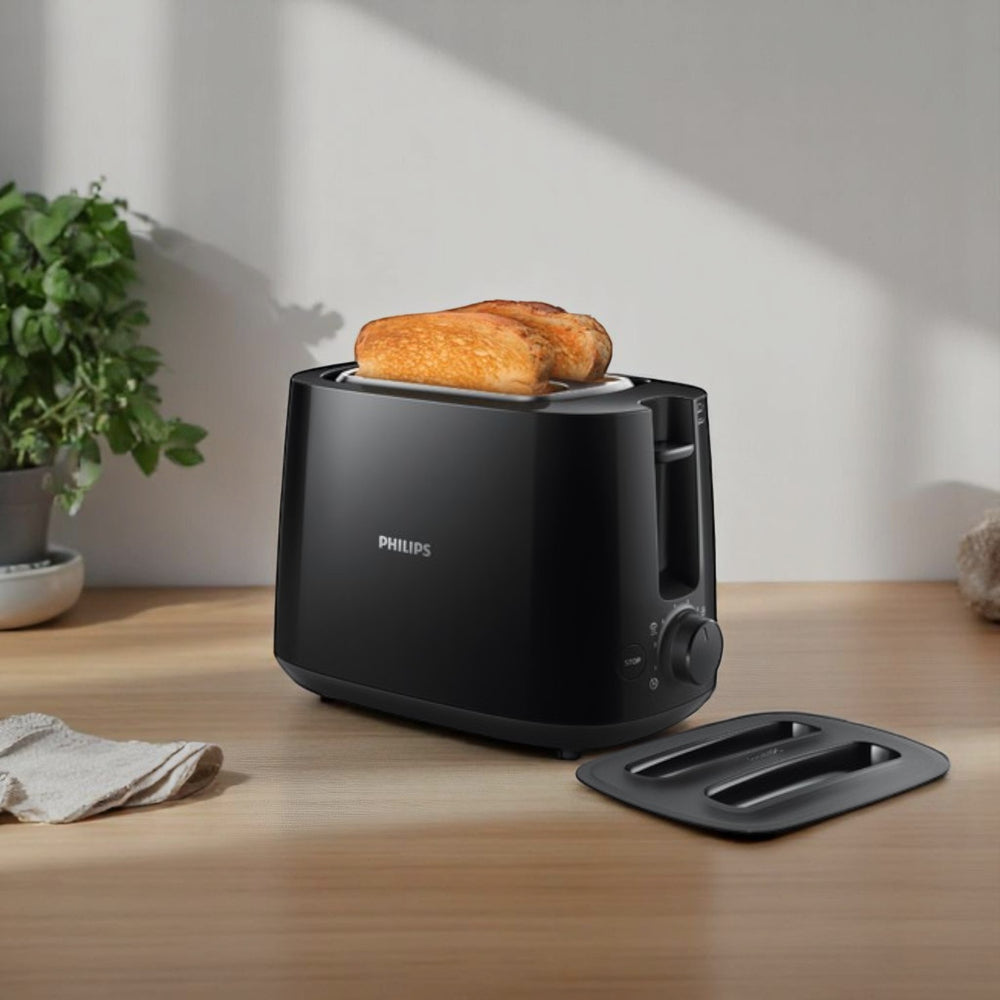 Philips HD2582 800W black 2-slice pop-up toaster with browning control and removable crumb tray.