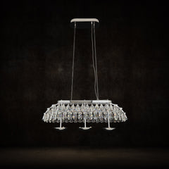 Qulik Allure crystal chandelier with silver finish, layered crystal pendants and suspended linear hanging design.