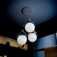 Qulik Modern Moon Ball 3-light hanging light with spherical white glass shades and black decorative caps, model QL-5203-3.