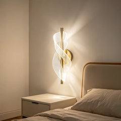 Qulik modern wall light with gold finish, vertical rod and illuminated twisted ribbon design for decorative indoor lighting.
