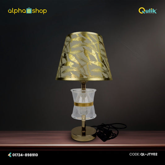 Qulik Nature's Glow table lamp with gold leaf-pattern shade, crystal-style center and polished gold base, model QL-JTY02.
