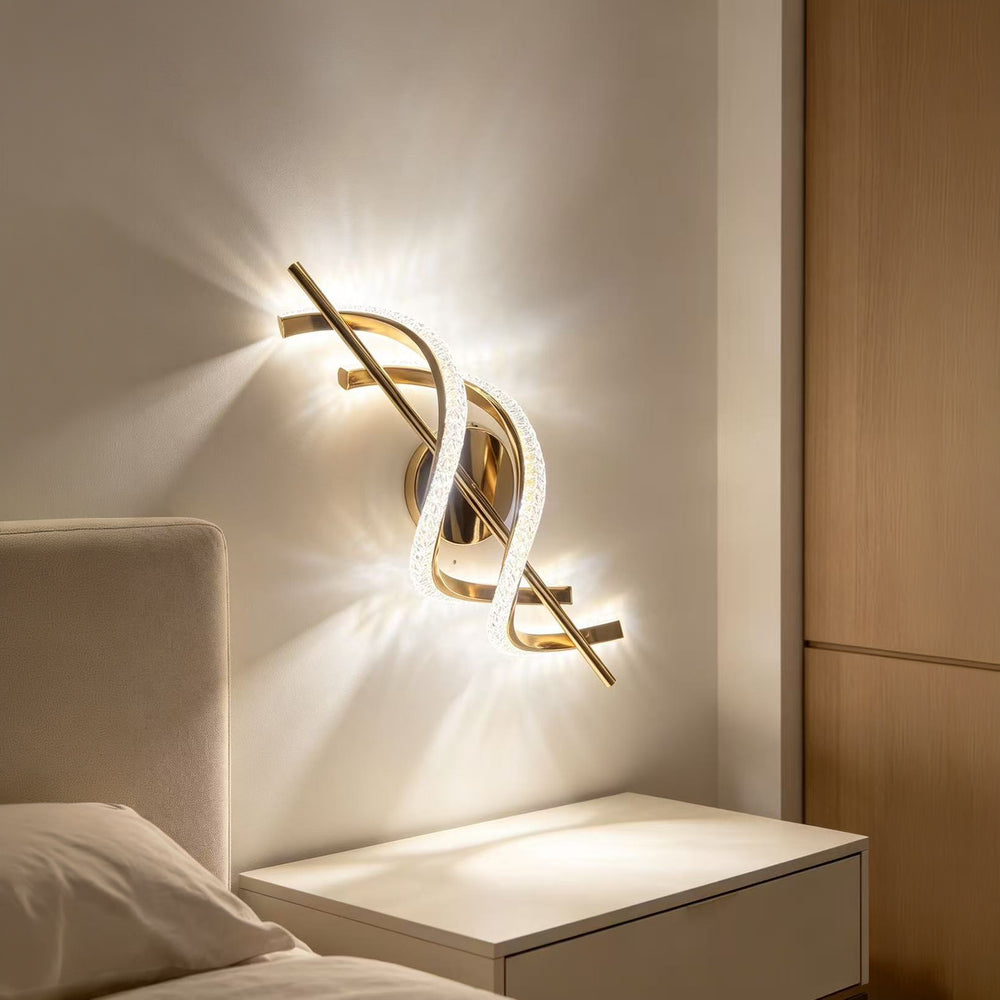 Qulik Nordic modern LED wall light with gold finish, curved crystal loop design and decorative illuminated frame.