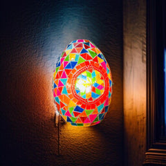 Qulik Turkish NovaEgg mosaic wall light with an egg-shaped shade, colorful geometric glass tiles and a vibrant illuminated mosaic design, model QL-ZQB23092.