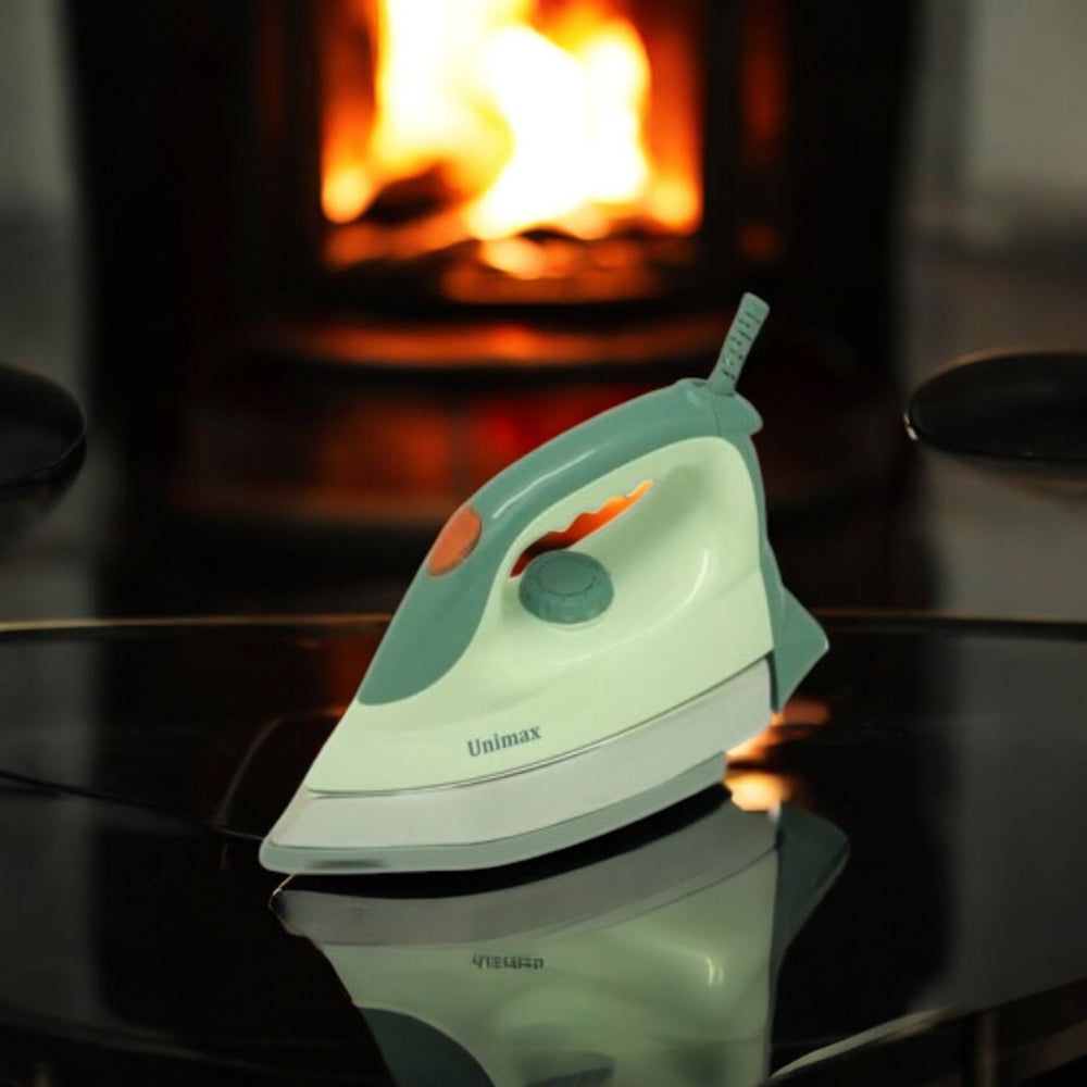 Unimax UHI-24 HD heavy iron in white and mint green with temperature control dial, ergonomic handle and smooth soleplate.